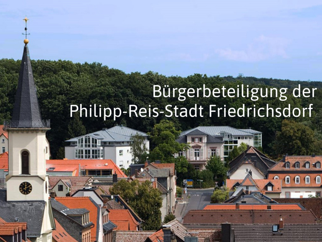 Blick von oben auf Friedrichsdorf, auf der Grafik ist der Text "Bürgerbeteiligung der Philipp-Reis-Stadt Friedrichsdorf" zu lesen.