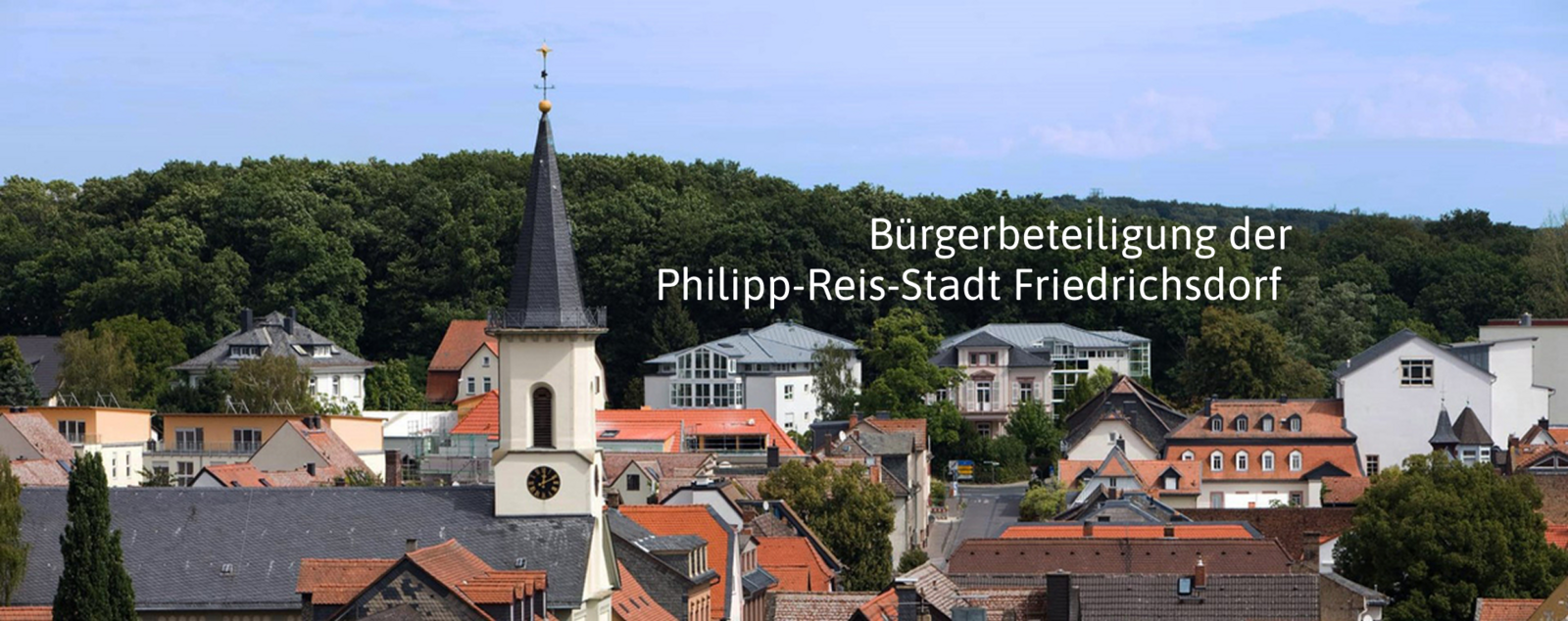 Blick von oben auf Friedrichsdorf, auf der Grafik ist der Text "Bürgerbeteiligung der Philipp-Reis-Stadt Friedrichsdorf" zu lesen.
